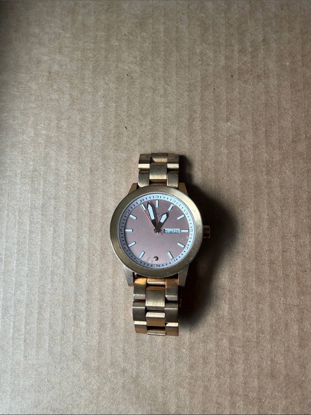 Nixon Women's Gold Tone Watch with Pink Dial